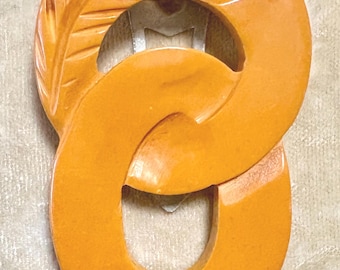 A Vintage Bakelite Art Deco Style Intertwined Circles Dress Clip