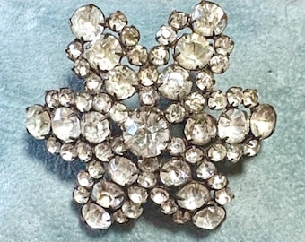 An Antique Pot Metal Brooch in a Starburst Design with Clear Stones...Possibly Paste