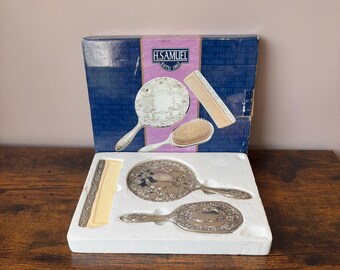 Vintage silver plated boxed three piece dresser set, hairbrush set