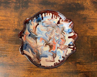 Vintage multicoloured ceramic dish, scalloped edge, swirl glaze