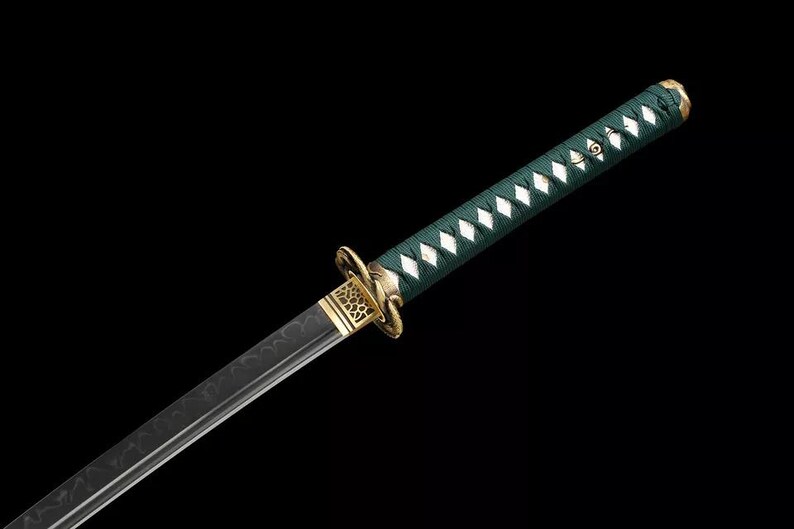 May include: A Japanese-style sword with a dark blade and a green handle wrapped in a diamond pattern. The hilt features gold-colored accents and a decorative guard. The sword is set against a black background.