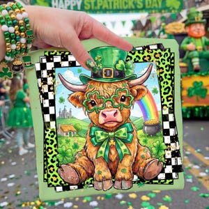 May include: A green square image featuring a cartoon Highland cow wearing a leprechaun hat and shamrock glasses. The cow has a green bow tie and sits in front of a rainbow and a pot of gold. The image is surrounded by a black and white checkered border and a green leopard print.