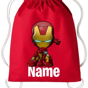 May include: Red drawstring bag featuring a cartoon image of Iron Man in a superhero pose. The bag has white drawstrings and the text "Name" printed below the image.