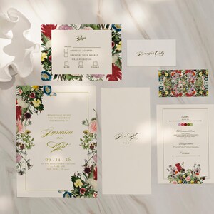 May include: Wedding invitation suite with floral designs. The main invitation features a floral border with the names "Jasmine and Karl" and the date "09.14.26". The RSVP card has a floral border and a checklist for guests to indicate their attendance. The menu card features a floral design and a list of the meal options.