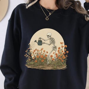 Skeleton Watering Garden Halloween Sweatshirt, Funny Fall Sweater, Cute Skeleton Gardening Top, Boho Halloween Apparel, Gift for Her