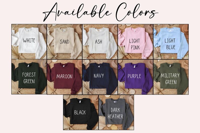 May include: A display of cropped sweatshirts in various colors, including white, sand, ash, light pink, and light blue. Other colors are forest green, maroon, navy, purple, military green, black, and dark heather. The text "Available Colors" is at the top.