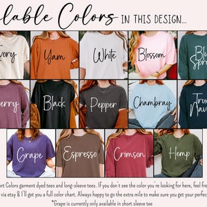 May include: A display of Comfort Colors t-shirts and long-sleeve tees in various colors, including Ivory, Yam, White, Blossom, Blue Spruce, Berry, Black, Pepper, Chambray, True Navy, Grape, Espresso, Crimson, and Hemp. The text "Available Colors" is at the top.