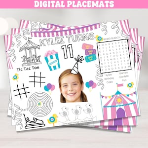 May include: Digital placemats with a circus theme, featuring a girl's photo, the text "Kylee Turns 11," and various activities like Tic Tac Toe, a maze, and a word search. The placemats are decorated with pink and white stripes and carnival-themed illustrations.