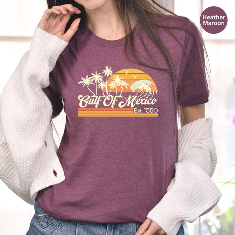 a woman wearing a shirt with palm trees on it