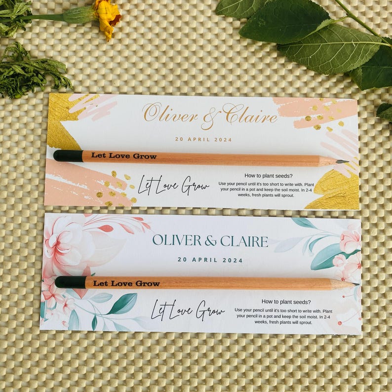 May include: Two wedding favor cards with a floral design and the text "Oliver & Claire" and "Let Love Grow". Each card has a wooden pencil with a black eraser and the text "Let Love Grow" printed on it. The cards include instructions on how to plant the pencil to grow a plant.
