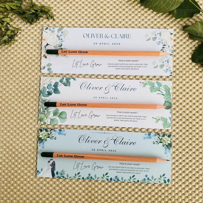 May include: Three wedding favor cards with a watercolor floral design. Each card features a pencil with embedded seeds and the text "Let Love Grow". The cards also include the names "Oliver & Claire" and the date "20 April 2024".