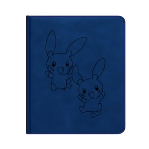 May include: A navy blue card binder with a stitched border, featuring two cartoon characters in black outline. The binder has a smooth, leather-like texture. The cartoon characters are smiling and have large ears.