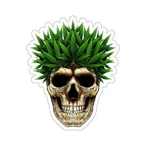 May include: A sticker depicting a human skull adorned with a crown made of green cannabis leaves. The skull has a detailed, aged appearance. The sticker has a white border and background. The image is a graphic.