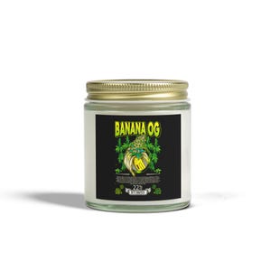 May include: A glass jar with a gold lid, displaying a black label with the text "BANANA OG" in yellow. The label features a banana graphic with cannabis leaves and the text "22% HYBRID".