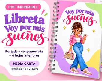 May include: A spiral-bound notebook with a cover featuring a cartoon illustration of a person in a pink jacket and blue jeans holding a phone and a handbag. The cover text reads "Voy por mis sueños". Includes interior pages labeled "Mis ideas" and "Mis notas". Dimensions are 14 x 21.5 cm.