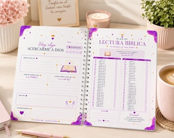 May include: A spiral-bound Bible study planner with white pages featuring purple accents, gold crown icons, and text in Spanish. The left page includes sections for daily verses, prayer, and gratitude, while the right page displays a structured reading plan.