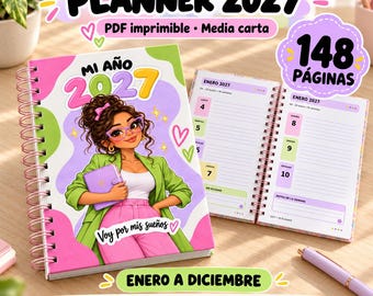 May include: A 2027 spiral-bound planner with a colorful cover featuring an illustration of a person with glasses holding a small notebook. The text reads PLANNER 2027, MI AÑO 2027, Voy por mis sueños, 148 PÁGINAS, and ENERO A DICIEMBRE.