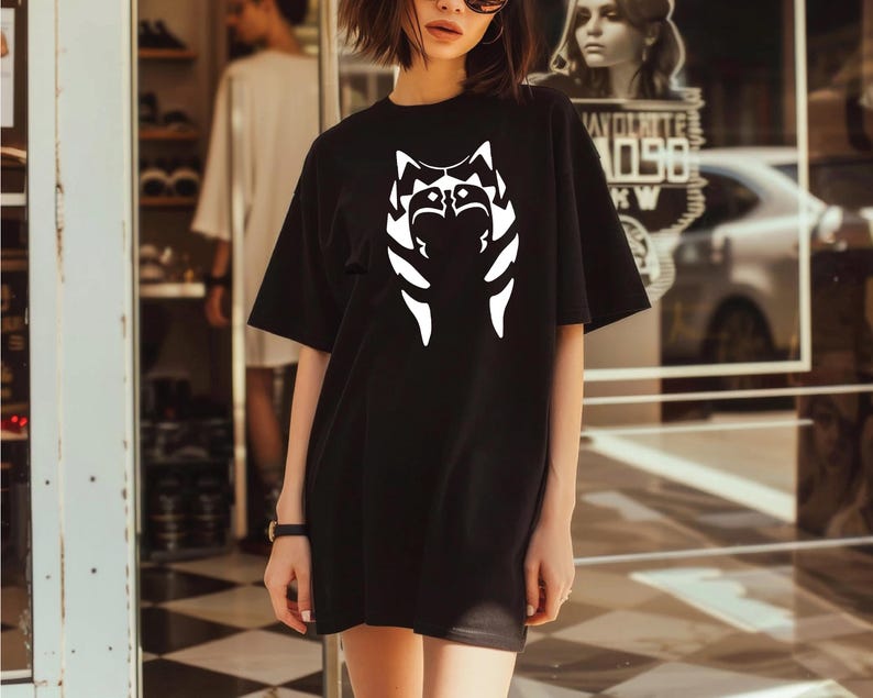 a woman standing in front of a store window
