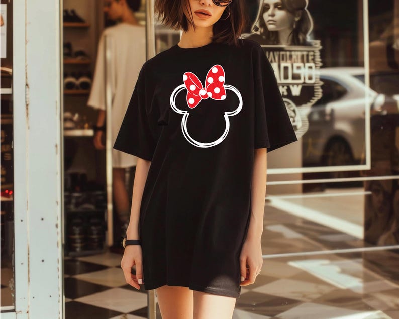 a woman standing in front of a store window