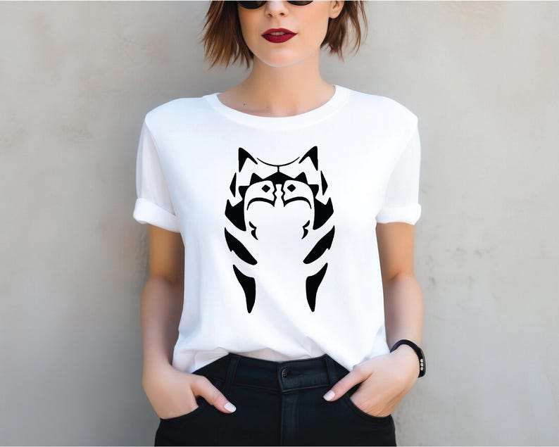 a woman wearing a white shirt with a black cat on it
