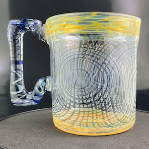 Borosilicate handblown glass mug heat resistant for coffee tea or hot beverage. Freeform handle with cobalt blue and honeycomb designs