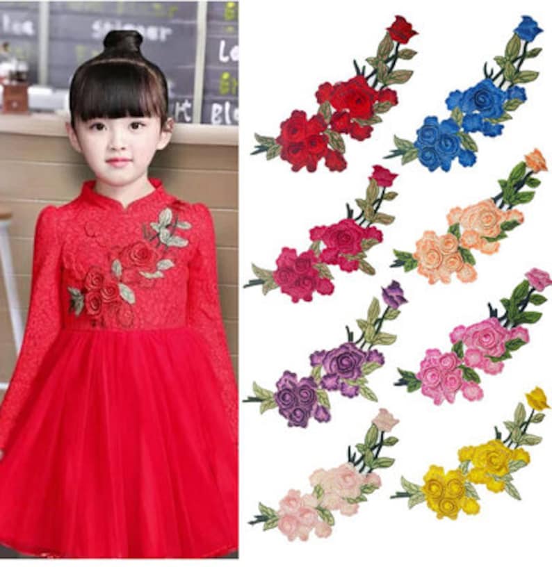 May include: Assortment of ten embroidered iron-on patches featuring a cluster of roses with stems and leaves. The patches are available in ten colors: red, blue, pink, purple, orange, yellow, light pink, dark pink, light blue, and dark blue.