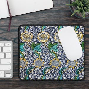 May include: A blue and white floral patterned mouse mat with a white computer mouse on top. The mouse mat has a black border.