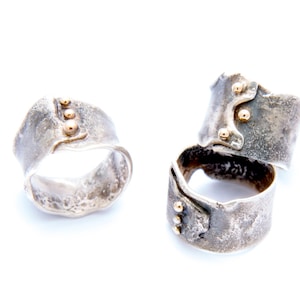 Reticulated sterling silver band with gold accents