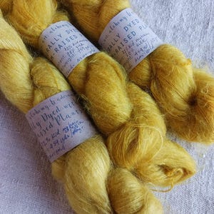 Naturally dyed kid mohair and silk yarn.  Dyed with plants grown on our Virginia farm.