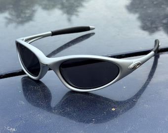 Oakley Minute 1.0 Black and Grey Eye Jacket Redux Prizm Iridium