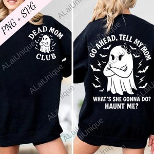 May include: Black sweatshirt with white graphic text and illustrations. The front reads "DEAD MOM CLUB" with a ghost illustration. The back says "GO AHEAD, TELL MY MOM" with a ghost illustration and the text "WHAT'S SHE GONNA DO? HAUNT ME?"