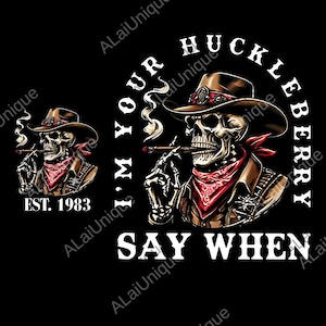 May include: Graphic design featuring a skeleton cowboy smoking a cigar, wearing a brown hat, jacket, and a red bandana. Text includes "I'M YOUR HUCKLEBERRY" and "SAY WHEN". The design also includes "EST. 1983".