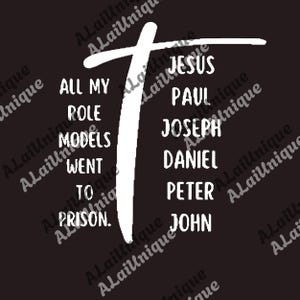 May include: Black graphic design with white text. The text reads "ALL MY ROLE MODELS WENT TO PRISON." and lists names including Jesus, Paul, and John. A white cross shape is also present.