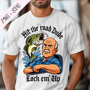 May include: White t-shirt with a cartoon illustration of a man and a fish, with the text "Hit the road Dude" and "Lock em' Up". The man wears a blue plaid shirt. The fish is green and black.