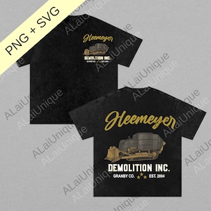 May include: Black t-shirts with a front and back design. The front features the text "Heemeyer" above a bulldozer graphic and "DEMOLITION INC. GRANBY CO. EST. 2004". The back has the same design. The shirts are labeled "PNG + SVG".