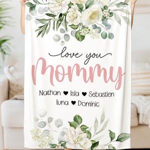 May include: White floral throw blanket with the text "love you mommy" and names "Nathan, Isla, Sebastian, Luna, Dominic" with hearts between each name.