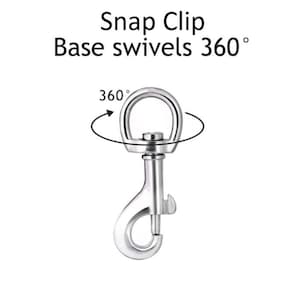 May include: A silver swivel snap clip with a 360 degree rotating base. The clip is designed for attaching to leashes, collars, or other items.