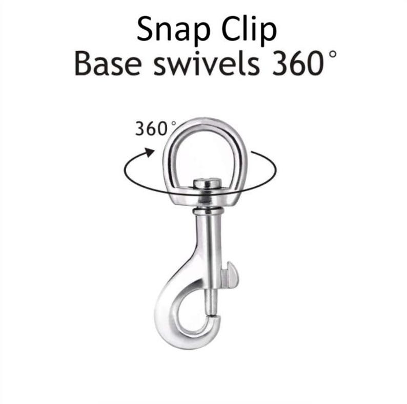 May include: A silver swivel snap clip with a 360 degree rotating base. The clip is designed for attaching to leashes, collars, or other items.
