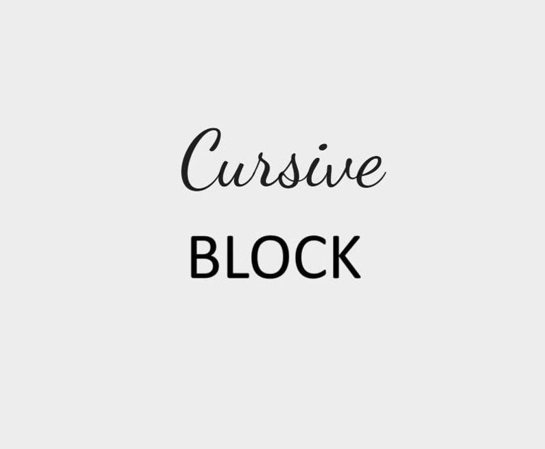 May include: The word "Cursive" written in cursive script, followed by the word "BLOCK" in all caps.