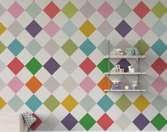 May include: A white wall with a colorful diamond pattern wallpaper. The wall has a wooden shelf with a white rabbit figurine, a small potted plant, and a scale. There are also wooden blocks with letters and numbers on the floor.
