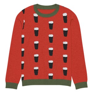 May include: Red long-sleeve sweater with a green trim and a pattern of black and white pint glasses.