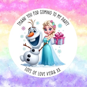May include: A circular sticker with Elsa and Olaf from Frozen. Elsa wears a blue dress and holds a present. Olaf is a snowman with a carrot nose. The sticker has the text "THANK YOU FOR COMING TO MY PARTY" and "LOTS OF LOVE KEIRA XX".