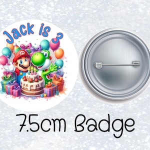 May include: A 7.5cm circular pin-back badge featuring a colourful illustration of Mario and Yoshi with a birthday cake and presents. The text 'Jack is 3' is printed in blue at the top. The back of the badge shows a silver metal pin mechanism.