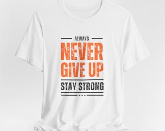 May include: White t-shirt with the text "Always Never Give Up Stay Strong" in black and orange lettering.