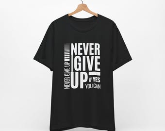 May include: Black t-shirt with a white graphic that says "NEVER GIVE UP" and "#YES YOU CAN".