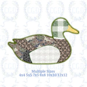 May include: A fabric duck applique with a camouflage body, a green and white checkered head, and a yellow beak. The duck has a white belly and is outlined with green stitching. Text at the bottom reads "Multiple Sizes" with size options.