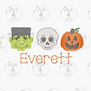 May include: A Halloween-themed embroidery design featuring a green Frankenstein monster, a white skull, and an orange jack-o'-lantern. The design includes the name "Everett" in orange.