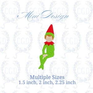 May include: An embroidered design of a seated elf wearing a green outfit, a red hat, and a red collar. The text "Mini Design" is above the elf. The text "Multiple Sizes" and the sizes 1.5 inch, 2 inch, and 2.25 inch are below the elf.