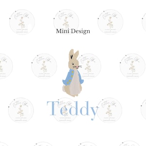 May include: A white background with a beige bunny rabbit wearing a blue jacket and the text "Teddy" in blue. The background is also decorated with small white circles with a floral design and the text "Cotton & Co. Classic Applique Embroidery Design" in gray.