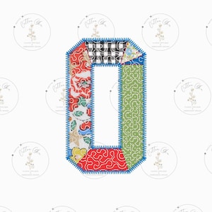 May include: A patchwork letter O made of different fabrics in red, green, blue, white, and black. The letter is outlined in blue thread.